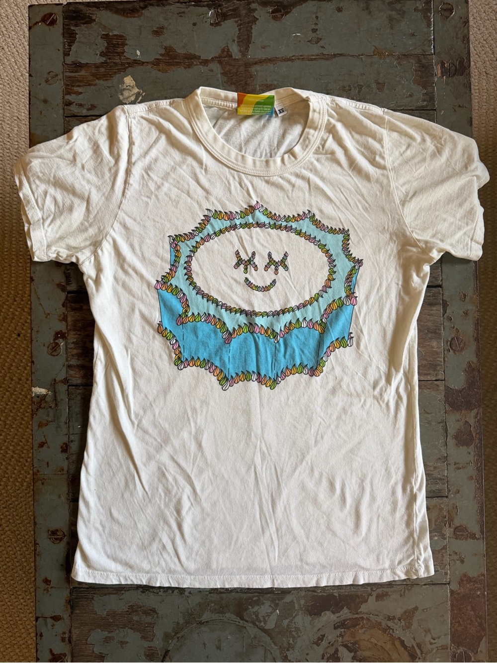 Big Bud Press 5 Year Anniversary White Tee with Turquoise Burst Smile Graphic